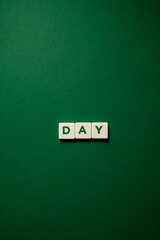 inscription day. Word day on a green background. Weekday business concept.