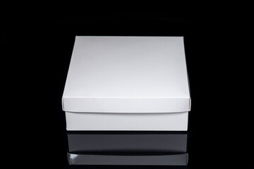 Package box rectangle, blank advertise template for products packaging. White color empty closed cardboard container against black background