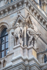 Fototapeta na wymiar Vienna, Austria - Main facade of City Hall, old Rathaus, in Vienna with many figures, art and sculptures