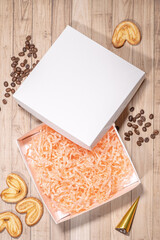 White box mockup between different sweets on the table and figures