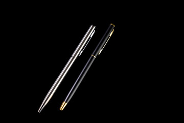 Ball pen duo silver and gold luxury. Two ball pens for signature in business solated on black background
