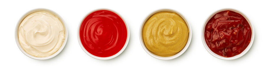 Bowls of various sauces on white background