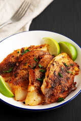 Homemade Pan Seared Tilapia on a Plate, side view.