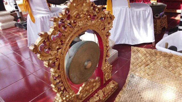 Small Gong from Balinese Gamelan Music Ensemble Golden Wood Carving in Bali Temple Ceremony