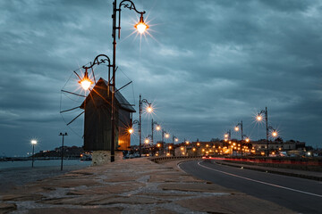 Old windmill at the entrance to Nessebar old town at sunset, Unesco Heritage site, Bulgaria
