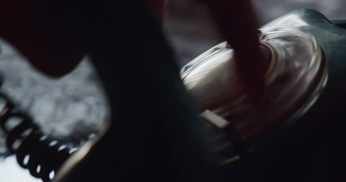 Close-up of a hand using a rotary dial to make a phone call