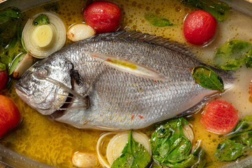 Dorado with tomatoes