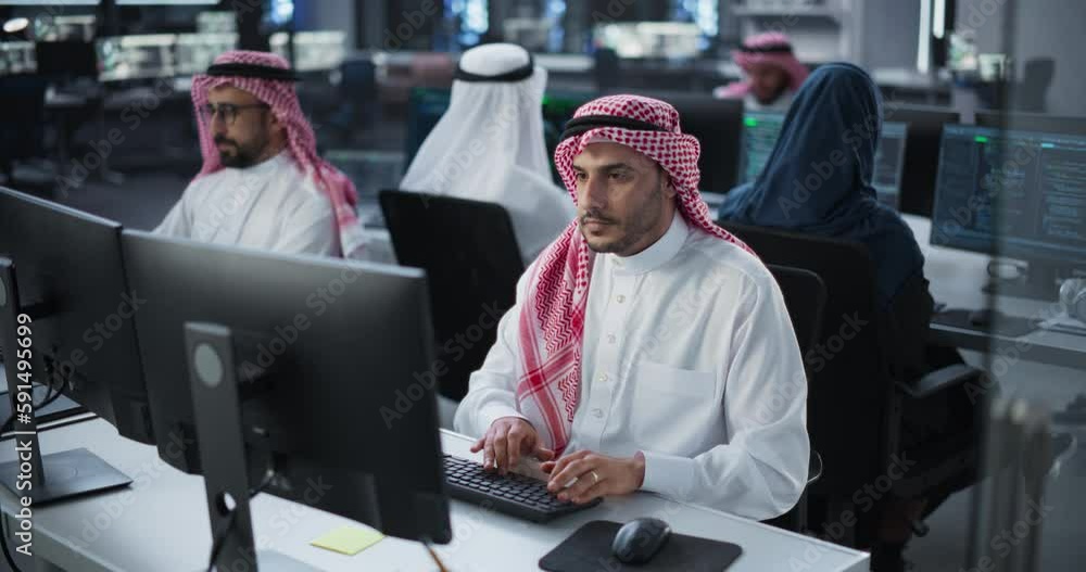 Aufkleber Team of Talented Young Middle Eastern Professionals Working in a Technological Research and Development Agency. Computer Screens with Software Code and Technical Neural Network Diagrams