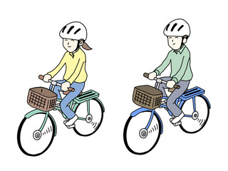 ヘルメットをかぶって自転車に乗る男女