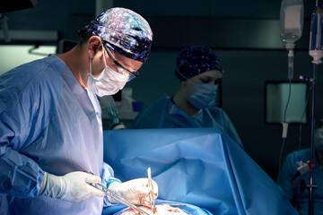 A team of surgeons in the oncological operating room, the fight against ancology, the hard work of...