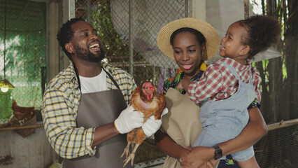 Happy farmer African family on livestock farm