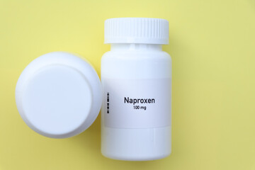 Naproxen pill in white bottle, pill stock