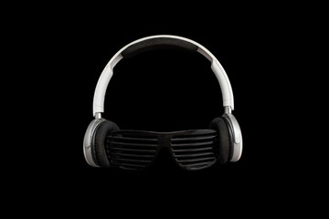Fototapeta na wymiar White headphones and black stripped sun glasseson black background