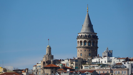 Istanbul city skyline in Turkey, Beyoglu district old houses with Galata tower on top, view from the Golden Horn in Eminönü side.