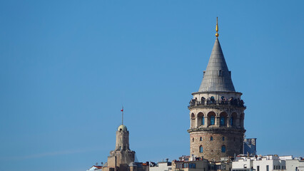 Istanbul city skyline in Turkey, Beyoglu district old houses with Galata tower on top, view from the Golden Horn in Eminönü side.