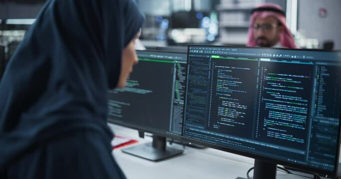 Smart Muslim Engineer Working on Computer in a Technological Corporate Office. Young Arab Woman in Hijab Developing Software for an Innovative Internet Service Provider. Close Up Portrait