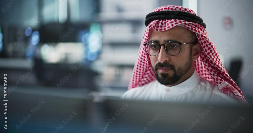 Aufkleber portrait of a middle eastern engineer working on desktop computer in a technological office environm