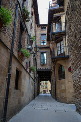 Fototapeta na wymiar Narrow street with small balconies, in Laguardia, Alava, Spain.
