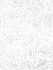 Defocus blurred transparent white colored clear calm water surface texture with splashes and bubbles. Trendy abstract nature background. Water waves in sunlight with copy space. White water shine