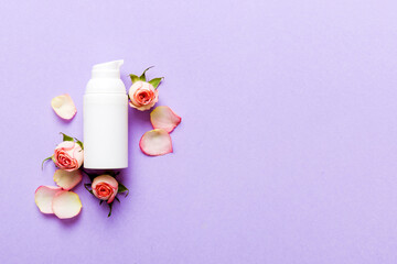 Fancy healthcare bottles for cream with rose flower. Natural oranic spa cosmetics concept. Mockup, template, Top view