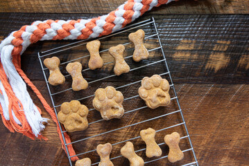 Fresh baked homemade dog snacks cooling on a wire rack.