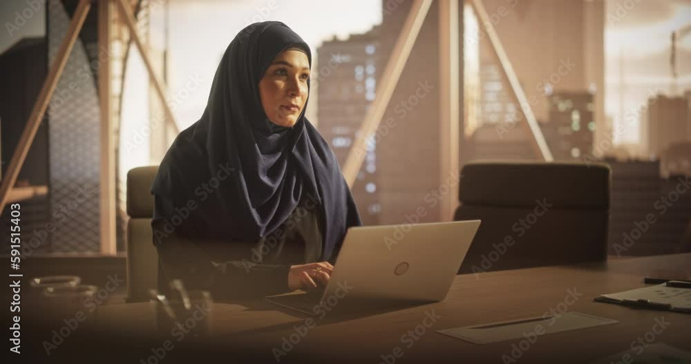 Aufkleber arab executive manager in a hijab working in a business research and development office on a laptop 