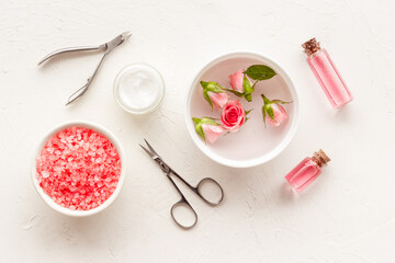 Manicure accessories with roses and towel. Beauty care salon spa.