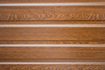 Brown steel background. Corrugated metal sheet texture background. Close up Texture. Corrugated reddish-brown iron sheet background close up. Blurred. Out of focus