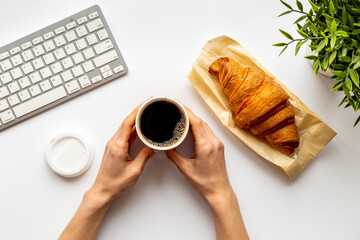 Coffee break in the office. Paper cup of coffee with keyboard, top view