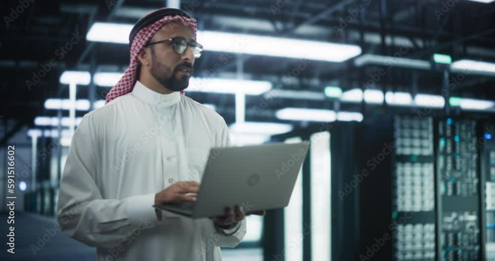 Aufkleber Saudi System Administrator Walks Between Rows of Operational Server Racks in Data Center. Engineer Uses Laptop Computer for Maintenance and Diagnostics in Cyber Security and Data Protection Facility