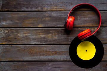 Listen to the music concept with vinyl records and headphones, top view