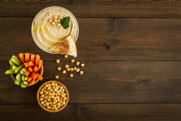 Chickpea hummus with vegetables sticks and pita croutons
