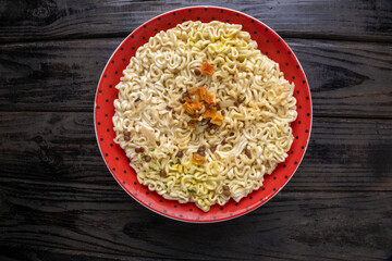 Instant vermicelli in a plate with seasoning.