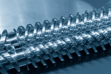Close up scene  the barrel screw of injection machine spare parts. - obrazy, fototapety, plakaty