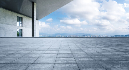 Empty square floor and city skyline with building background - obrazy, fototapety, plakaty