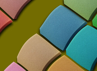 colorful square sponge foam pieces neatly arranged in a square shape with curvy style. soft...