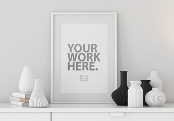 White Poster Art Frame Mockup with passepartout on commode with vases