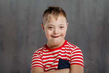 Portrait of little boy with down syndrome, studio shoot.