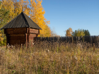 Reconstructed wooden watchtower of the 17th century and a palisade made of sharpened logs in the...