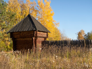Reconstructed wooden watchtower of the 17th century and a palisade made of sharpened logs in the...