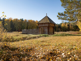 Reconstructed wooden watchtower of the 17th century and a palisade made of sharpened logs in the...