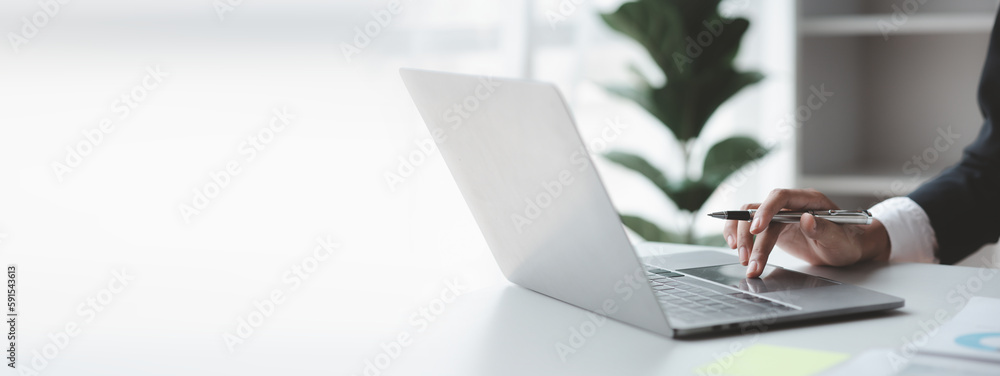 Poster a business man working in a private room, he is typing on a laptop keyboard, he uses a messenger to 