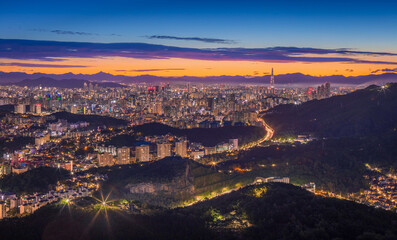 Fototapeta na wymiar Seoul City skyline and downtown and skyscraper at night is The best view and beautiful of South Korea at Namhansanseong mountain.