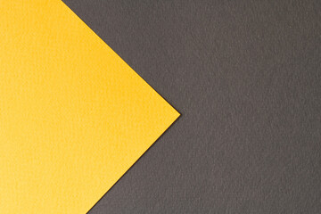 Rough kraft paper background, paper texture black yellow colors. Mockup with copy space for text