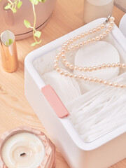 White plastic organizer for cosmetic products , makeup stuff and accessories, beauty room interior