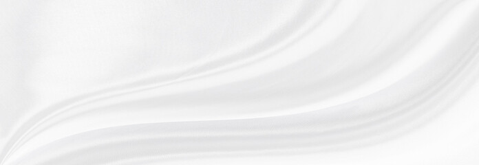 White gray satin texture that is white silver fabric silk panorama background with beautiful soft blur pattern natural.