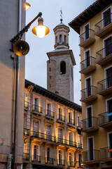 PAMPLONA, SPAIN - JULY 04, 2022: Streets of Pamplona at ​​night. Illuminated buildings. City...