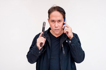 A police negotiator listens to the demands of a kidnapper via phone while brandishing a gun....
