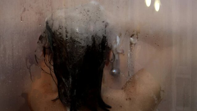 A girl in the hot shower.