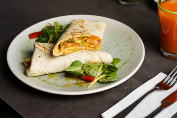 Wrapped Burrito with Beans and Vegetables on a Plate